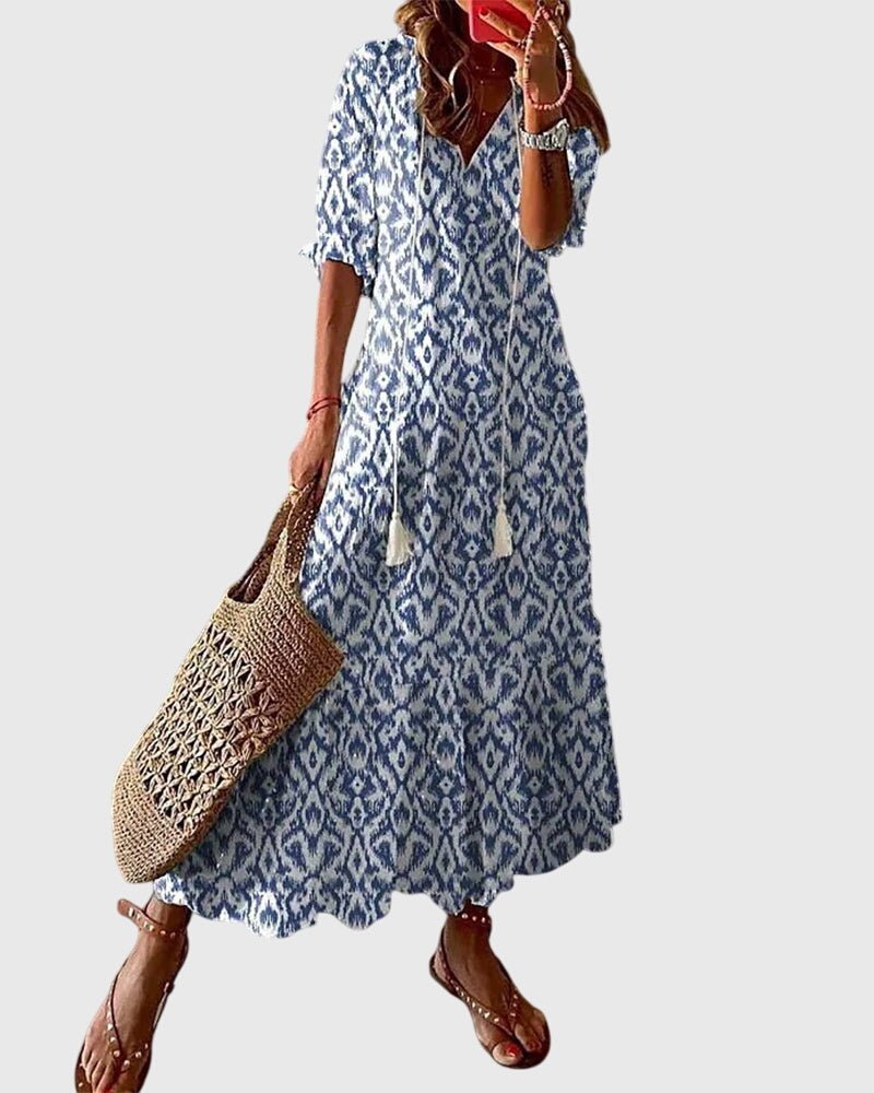Boho vintage summer dress featuring a flattering V-neckline, designed with a lightweight and breezy fabric for effortless casual elegance. 0